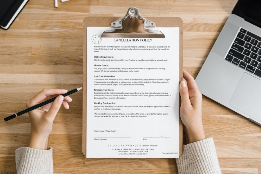 Massage therapy client reviewing massage policy on clipboard